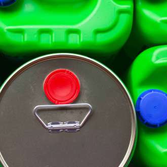 Canisters and jars for storing chemical liquids and fuels and lubricants, close-up.